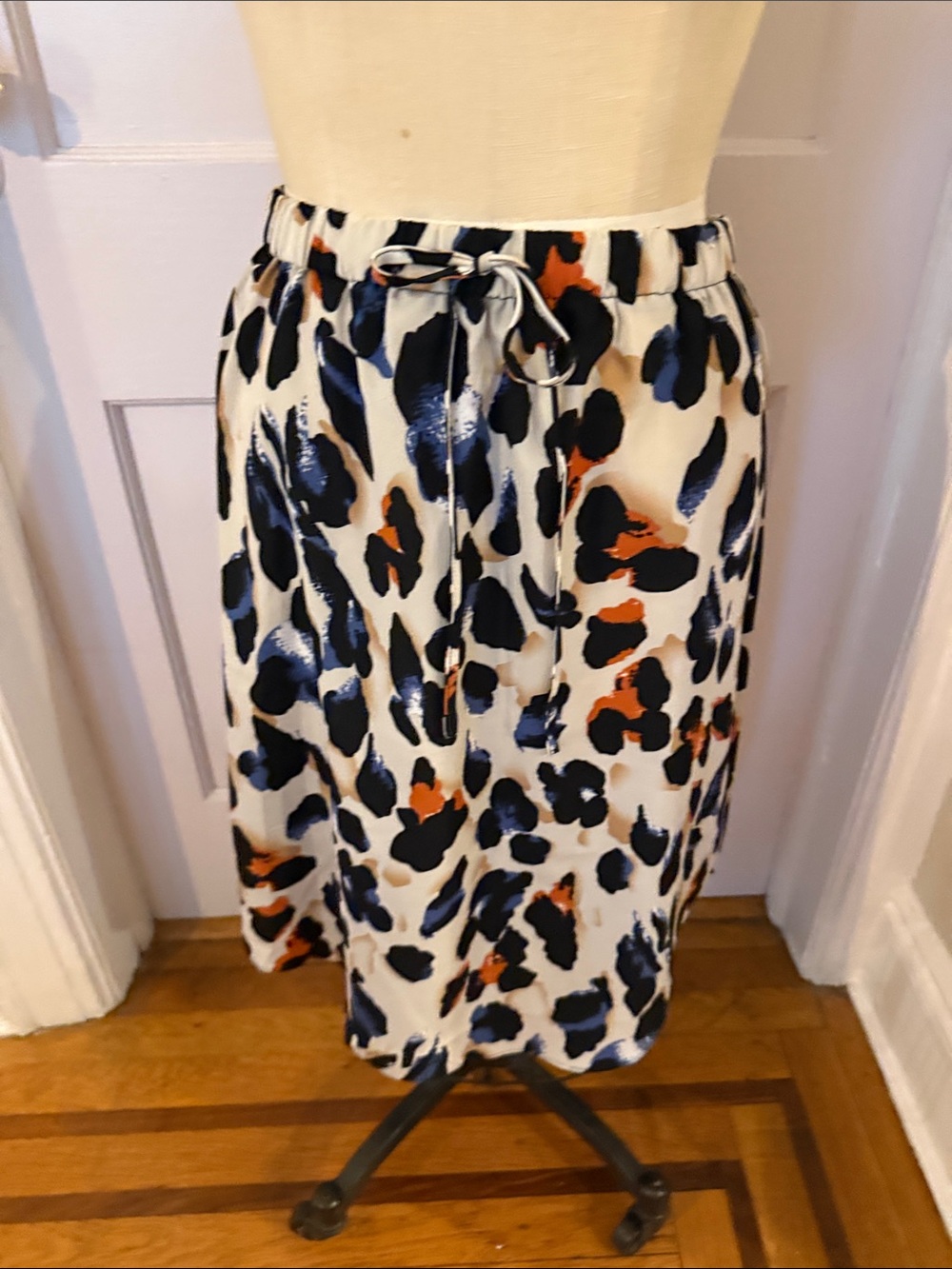 NWOT Colorful Animal Print Skirt with elastic side waist and shirt tail hem